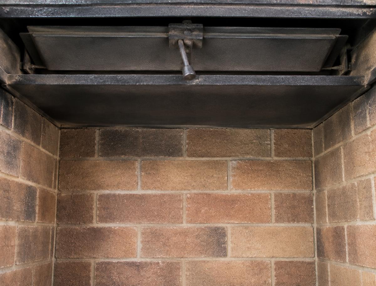 Smoke shelf inside a chimney coated with soot and debris